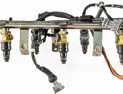 Fuel injectors in place on a fuel rail.