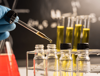 Gasoline being put into vials with a dropper