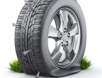 The tire in this illustration has gone flat due to a number of nail punctures