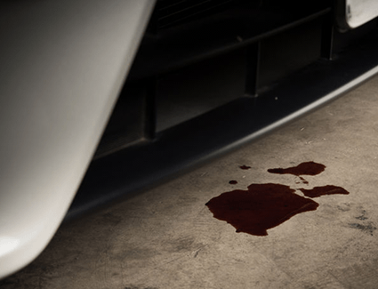 Oil puddle under car