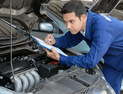 Technician inspecting engine