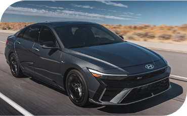 Gray Hyundai Elantra driving on a highway