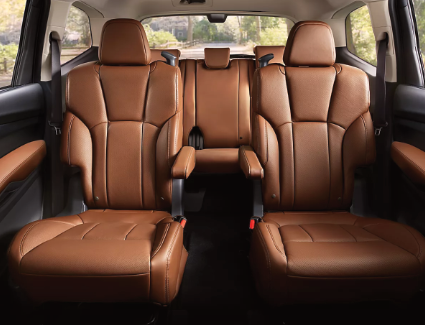New 2026 Subaru Ascent interior image Photograph of the 2nd and 3rd rows of seats inside a 2026 Subaru Ascent.