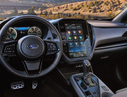 Interior cabin view of an all-new 2026 Subaru Crosstrek, looking out toward the mountains.