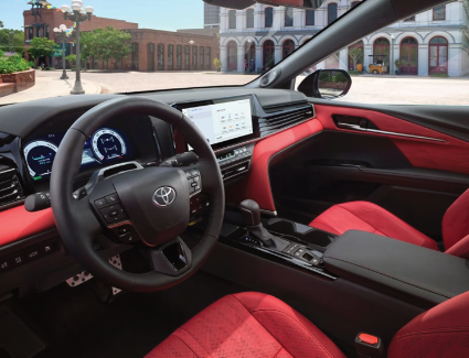 The new 2025 Toyota Camry XSE AWD interior shown in Red leather trim with available Premium Audio.
