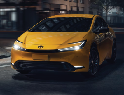 2026 Toyota Prius driving at night on a street