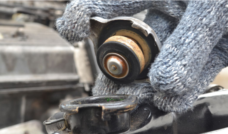 Nissan Radiator Cap being removed