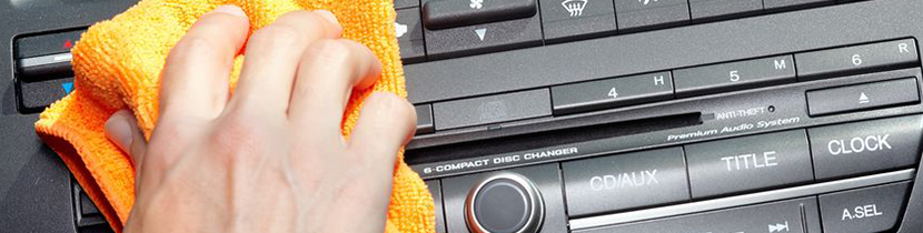 Cleaning a Subaru Dashboard Photograph of a person cleaning a dashboard with a cloth.