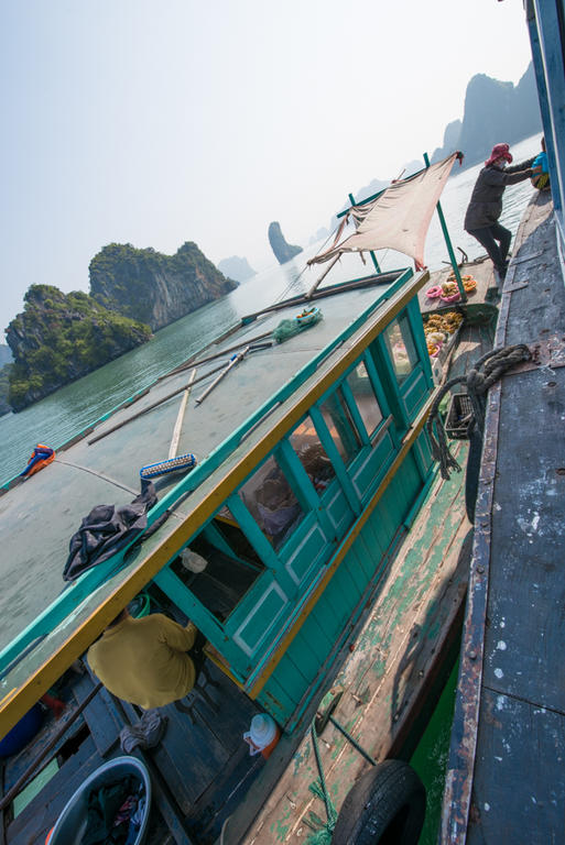 fruit vendors by boat, Halong Bay, Vietnam