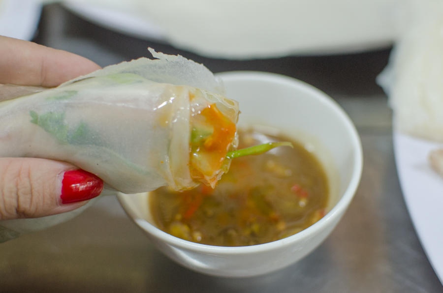 self serve Vietnamese spring rolls dipping in sauce, Con Market, Da Nang, Vietnam