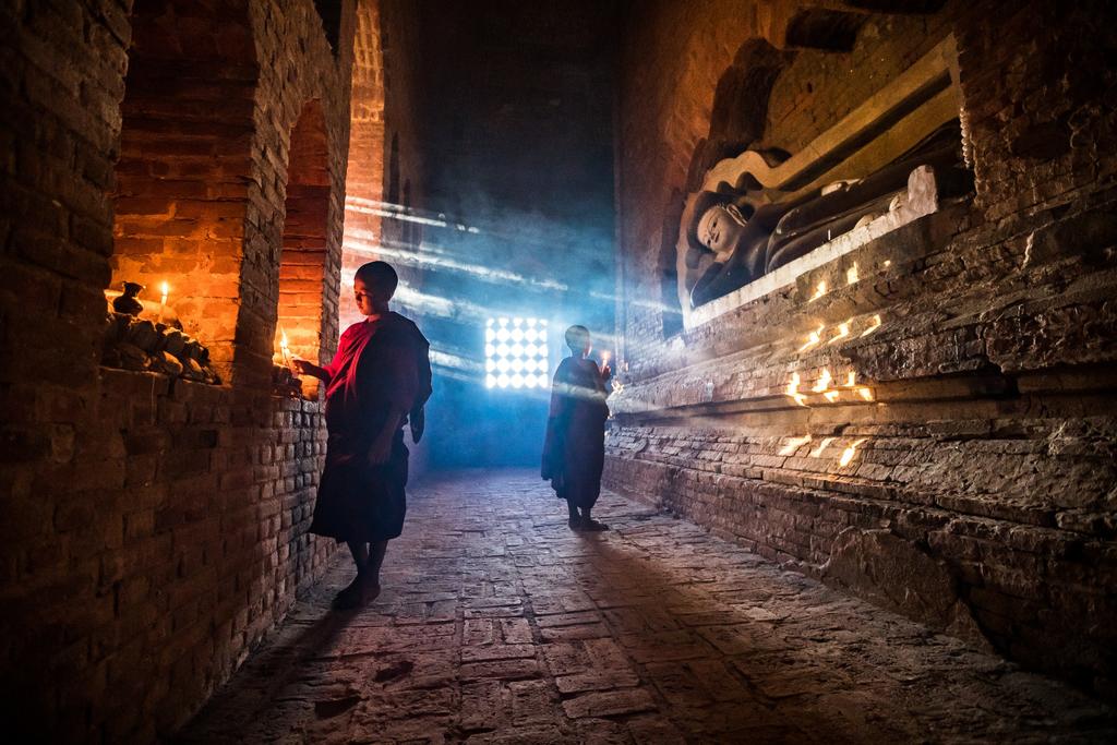 Young monks and candles, Bagan,