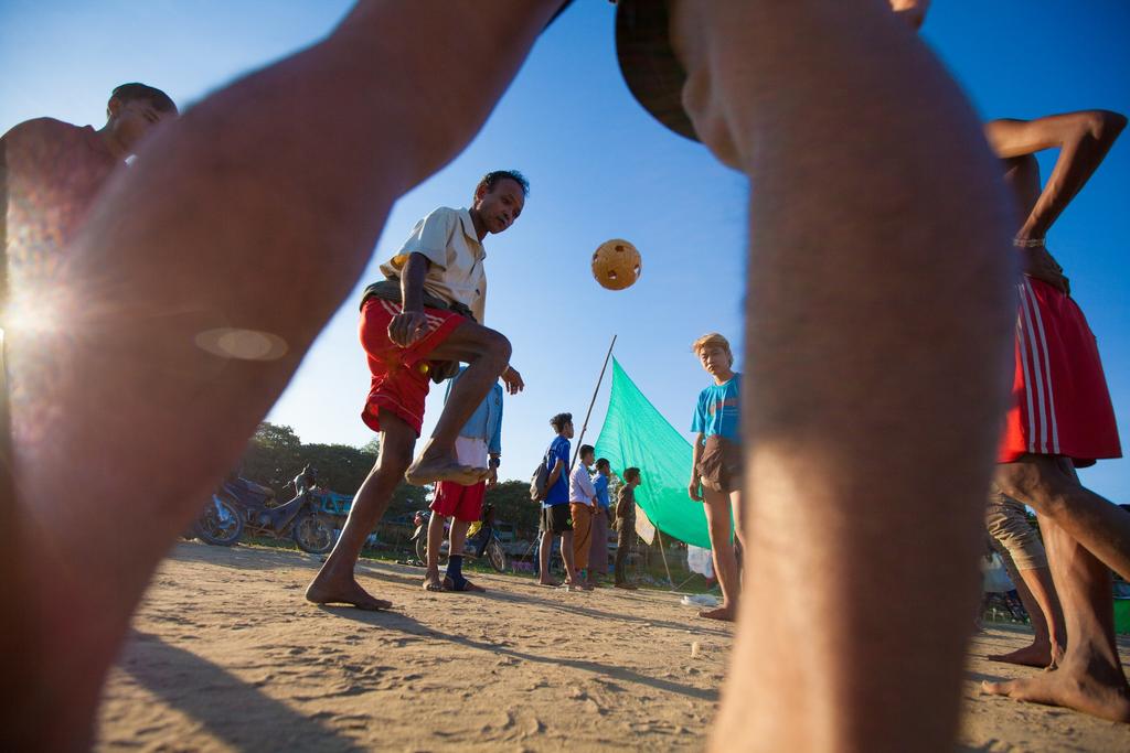 Burmese playing football