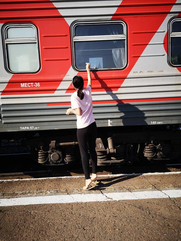 cleaning window for better view, Beijing to Moscow train