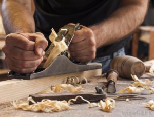 man-working-with-wood-with-shavings