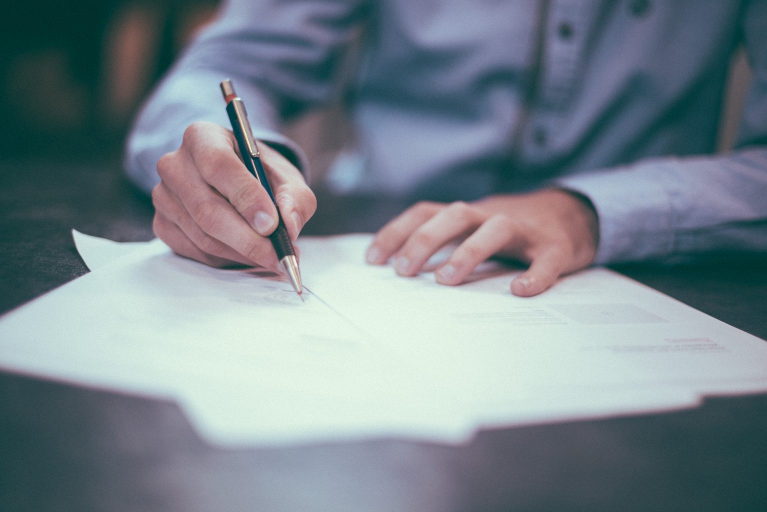 Man writing by hand