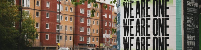 green and black graffiti on wall