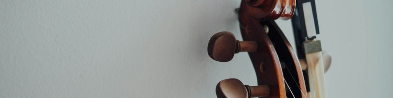 brown wooden stringed instrument headstock
