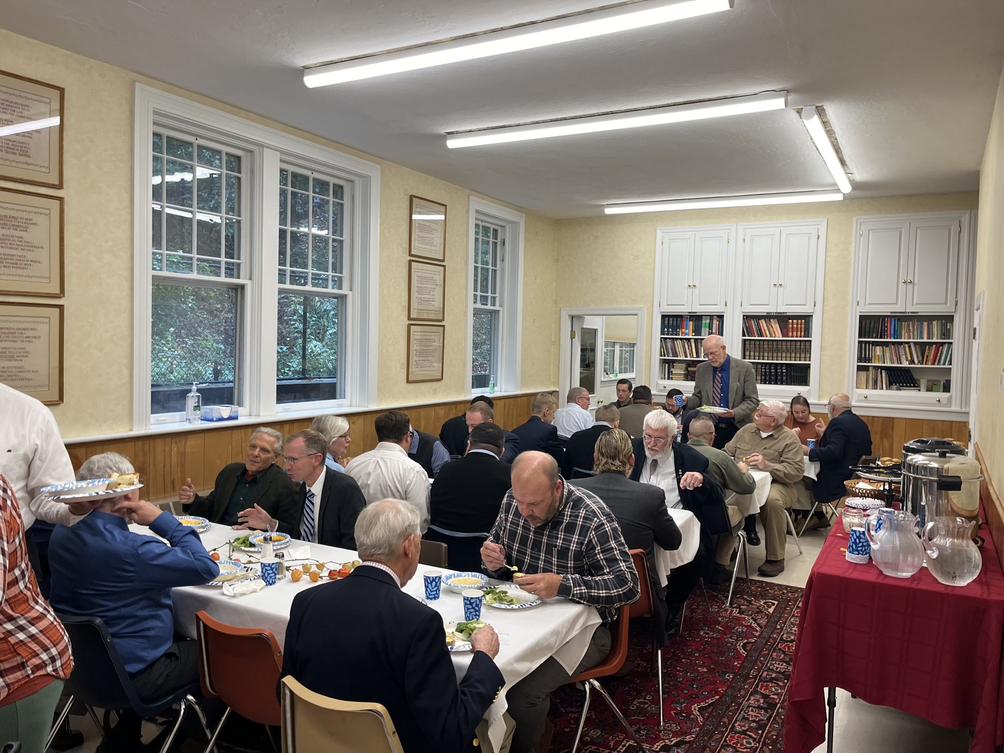Members of Grace OPC sharing a fellowship lunch in the church hall