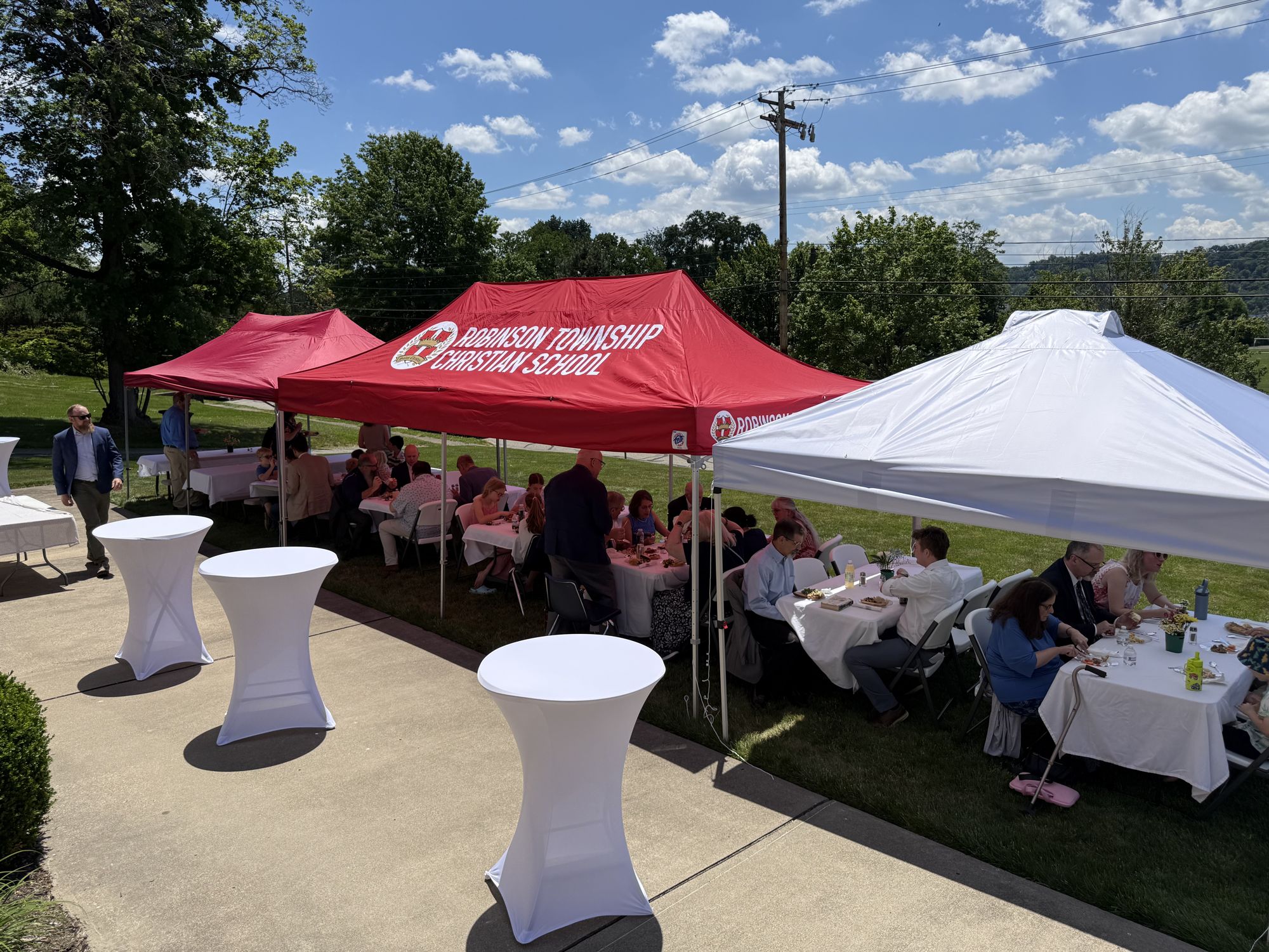 Tents and tables set up outside Grace OPC for a church gathering