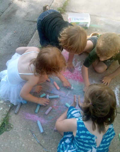 SLJ1307w_Editorial Kids with Chalk drawing on the side walk