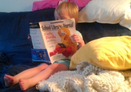 Pictures of the Week: A Future Librarian Enjoys SLJ's 'Early Birds' Cover Story