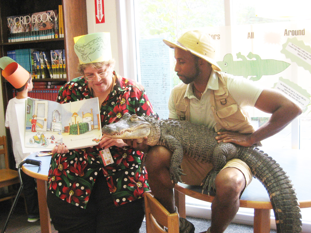 Queens (NY) Librarian Reads to Alligator to Reward Summer Reading