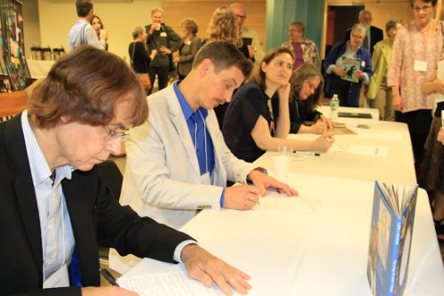 Finalists of the XX signed copies of their books for attendees. (l. to r.) The King of Little Things illustrator David T. Wenzel and author Bill Lepp (Peachtree)
