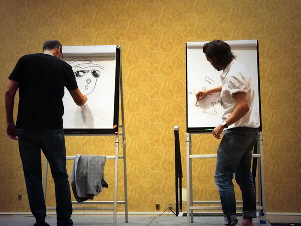 Oliver Jeffers and Loren Long take part in a draw off.