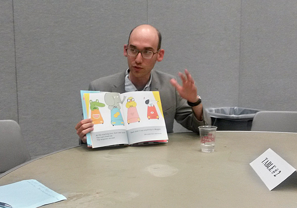 Author Greg Pizzoli takes part in author speed dating.