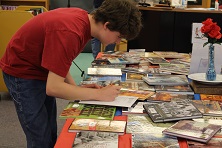 A student records his favorite reads on his menu.