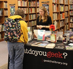 Sayre Public Library teen coordinator Holly O'Neill signs a student up for a library card.