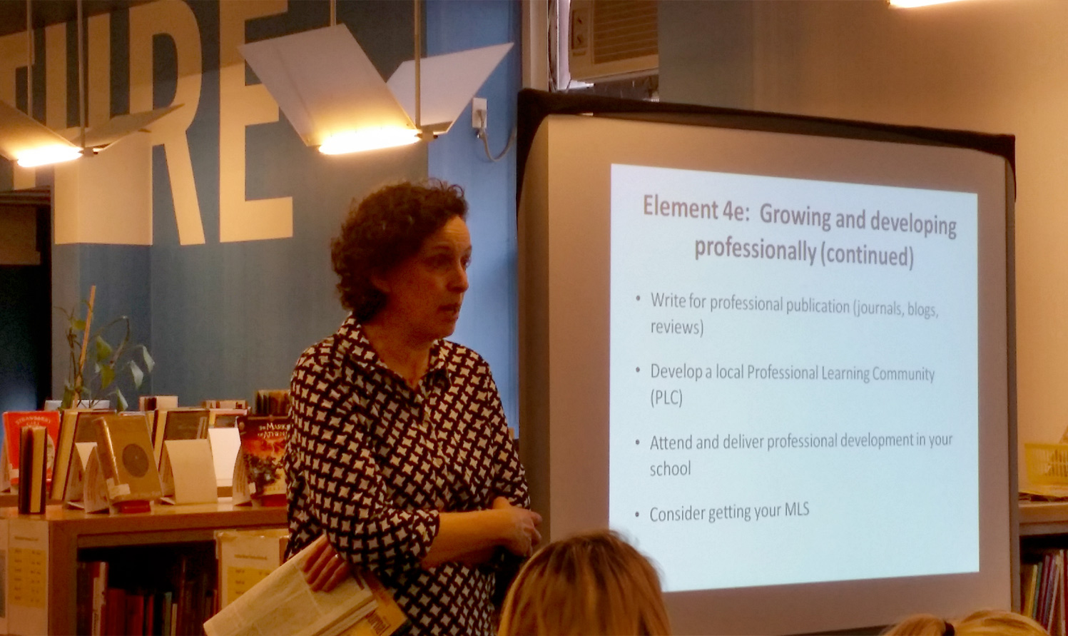 School Library Journal editor-in-chief Rebecca Miller talks to a group of new teacher librarians during a day of professional development.