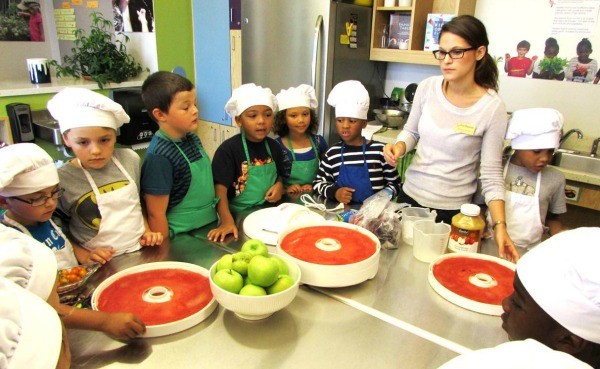 Students at Maplewood Richmond Heights Schools make applesauce as part of the district's Seed to Table project.