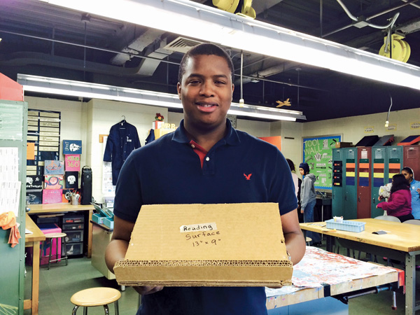 Adaptive Design teacher Charles Brown with a reading easel in progress.