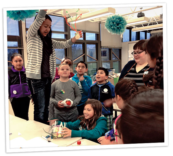 Students in the Michigan Makers program undertake an egg drop challenge with grad students from the University of Michigan School of Information. Photo by Kristin Fontichiaro/©2014 Regents of the University of Michigan.