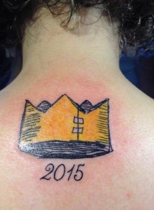 Victoria Stapleton's Beekle crown and Caldecott-winning year tattoo.