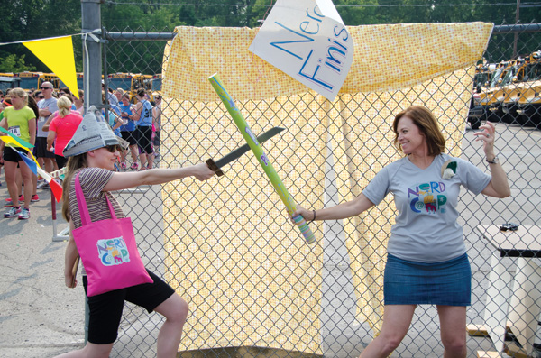 Author Jess Keating and fourth grade teacher (and Nerdcamp organizer) Suzanne Gibbs dueling during Nerd Run.