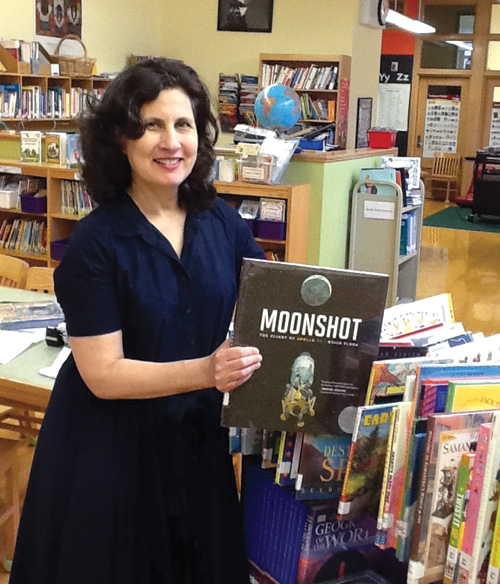 “Hands on top, now we stop!” is Cheryl Wolf’s upbeat call to order.