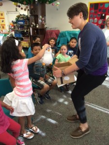 Shepherd Verbas with a child during a Shared Stories program at the Field Library.