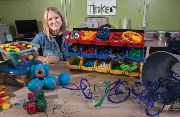 Angela Rosheim with items from the library maker space she created. Photo by Susan Pfannmuller