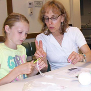 Knitting skills handed down from one generation to the next at Thomas Ford Memorial Library
