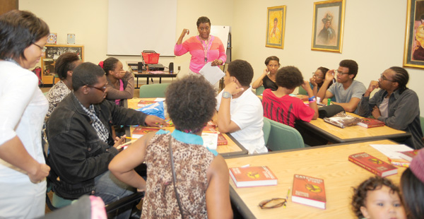 Demetria Tucker (center) serves teens at the Pearl Bailey Library in Newport News, VA. Below: a poster from the Pearl Bailey Library. Photo and poster art courtesy of the Pearl Bailey Library.