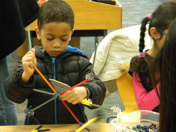 A boy explores building at Piscataway Library,