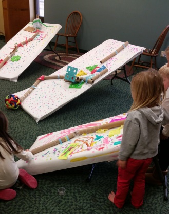 Teams at work on their unique marble runs.