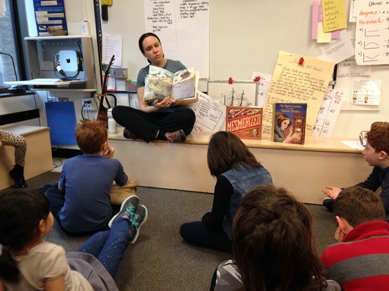 Children's librarian Allie Bruce reads Cook Prize contenders to Bank Street School students.