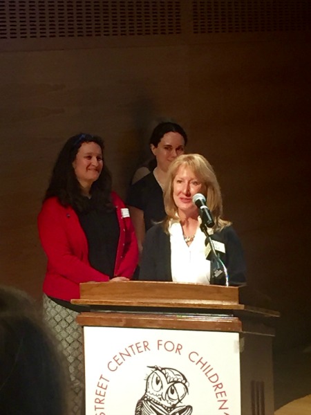 Anne Vittur Kennedy takes the podium. 