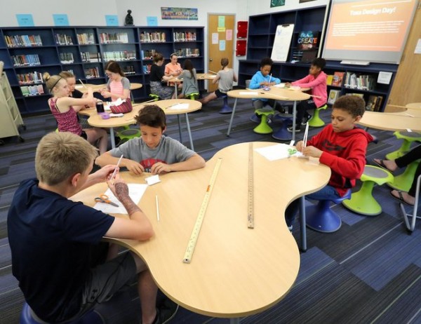 A recess-time design challenge at Longfellow Middle School. The voluntary activity served as a teaser of what kids can look forward to come fall. Photo by C.T. Kruger