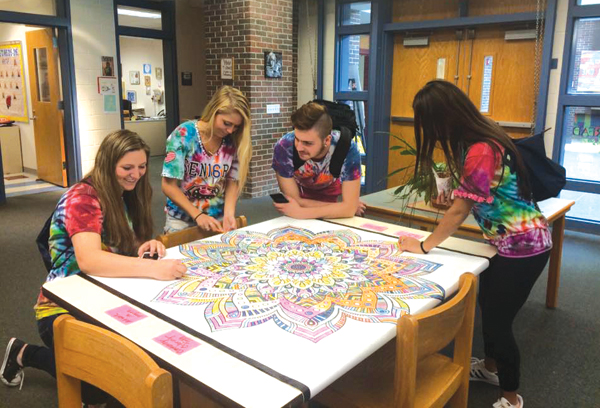 An oversized coloring sheet at Cellucci’s library offered students a chance to relax during finals in May and June. Photo courtesy of Westborough High School library