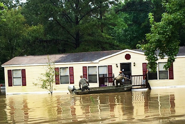Soldiers conduct evacuations by boat during severe flooding in Tickfaw, LA on August 13, 2016. Photo: Army National Guard