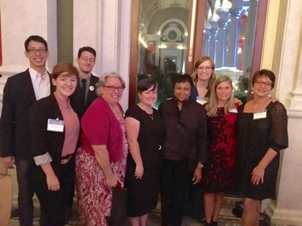 Authors gather around Carla Hayden. From left: Gene Luen Yang, Noelle Stevenson, Brendan Wenzel, Andrea Beaty, Kiersten White, Hayden, Shannon Hale, Jo Knowles, Meg Medina